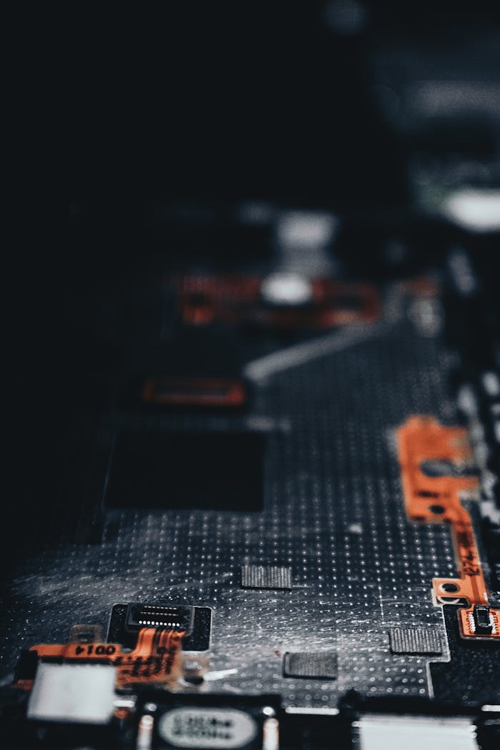 why-choose-us Close-up of a dark circuit board showcasing electronic components and connections.